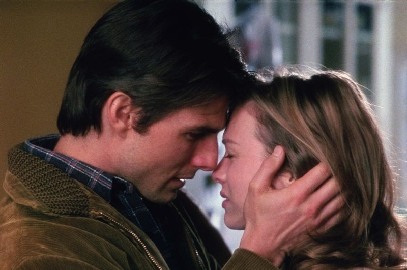  Tom Cruise as Jerry Maguire, standing with Renee Zellweger, in a heartfelt scene from the movie.
